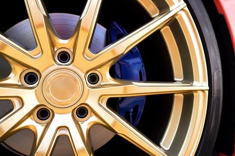 Alloy wheel with calipers and racing brakes of a sports car
