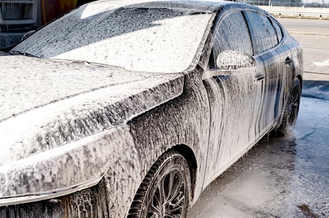 High pressure water jet with foam on car
