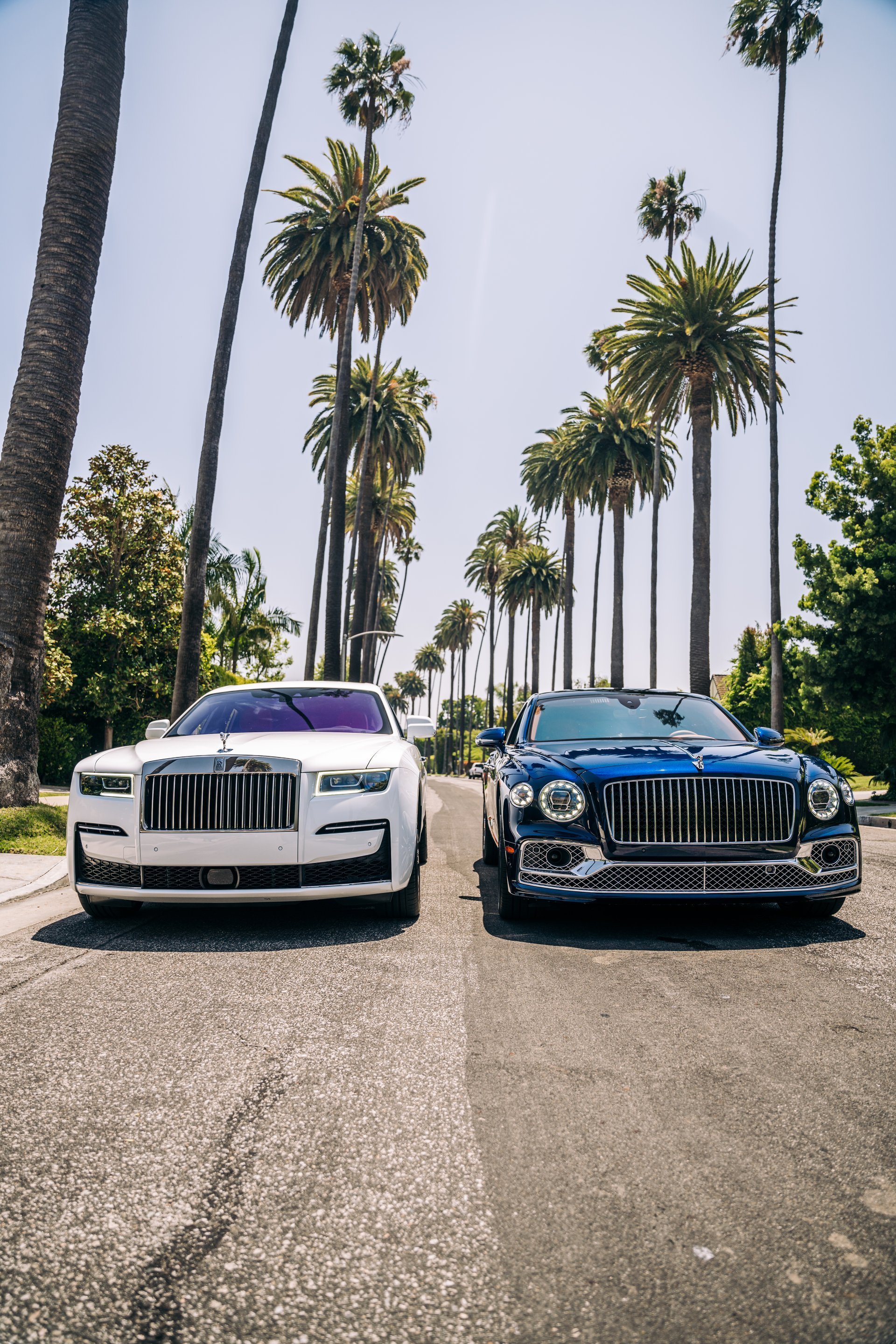 Bentley Flying Spur and Rolls Royce Ghost parked on a street